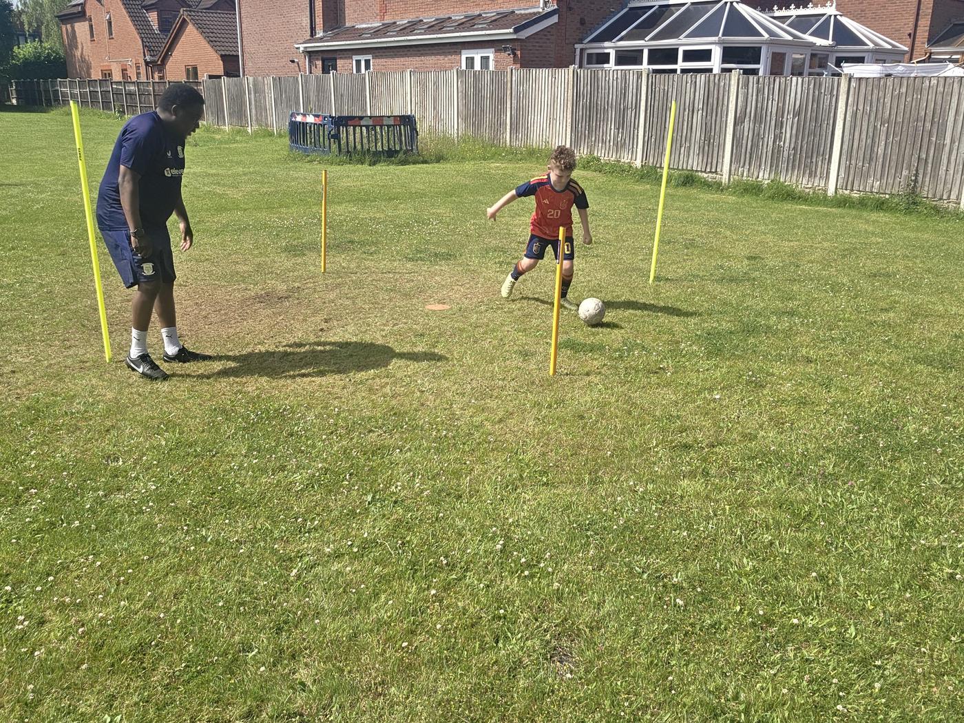 Coach demonstration on grass field