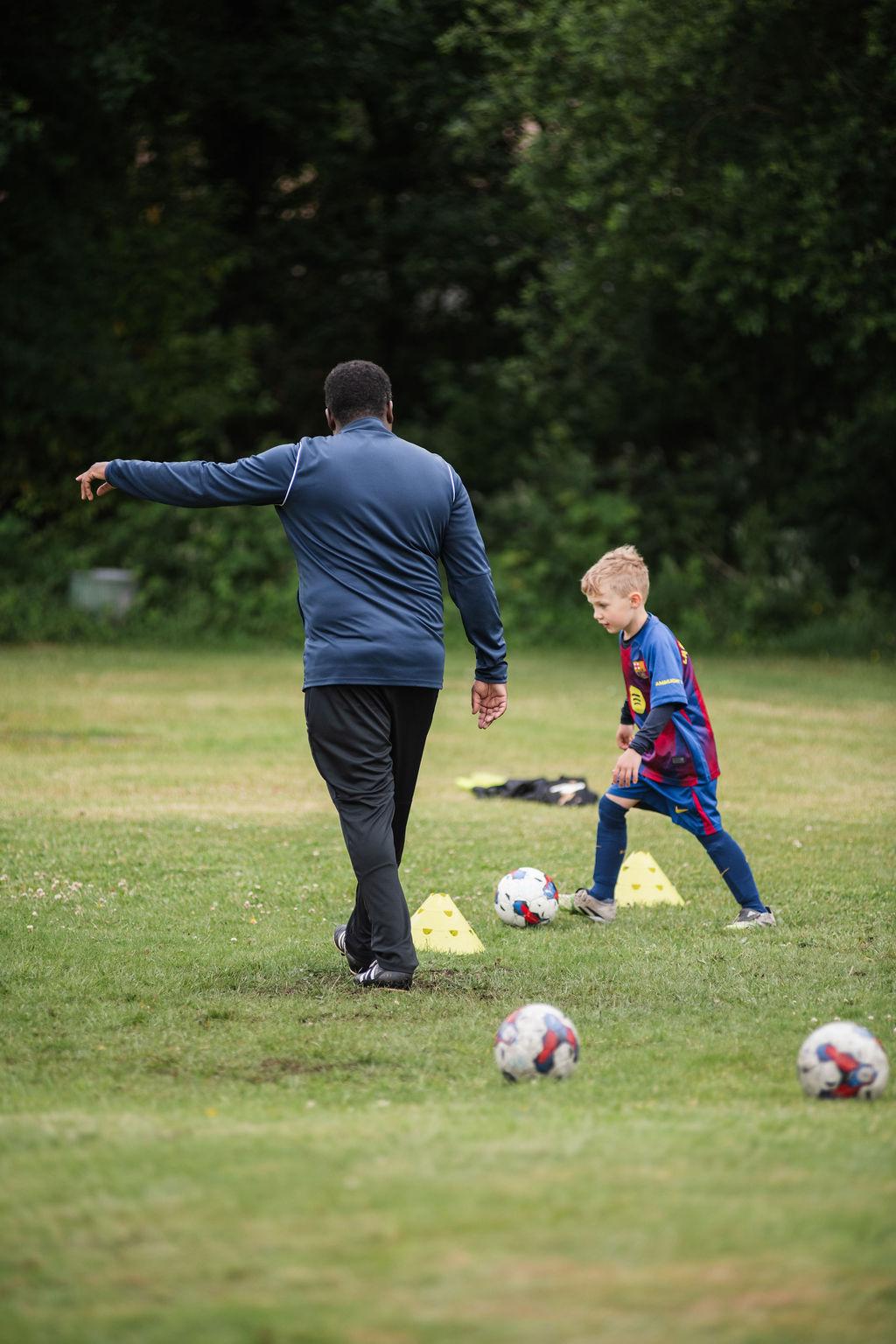 Coach Sagwatti directing tactical group training session